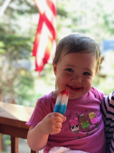 Avery enjoying a popsicle in Tahoe when she was 18 months old