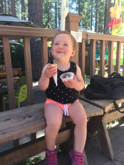 Avery having her first ice cream cone after a day at the lake!